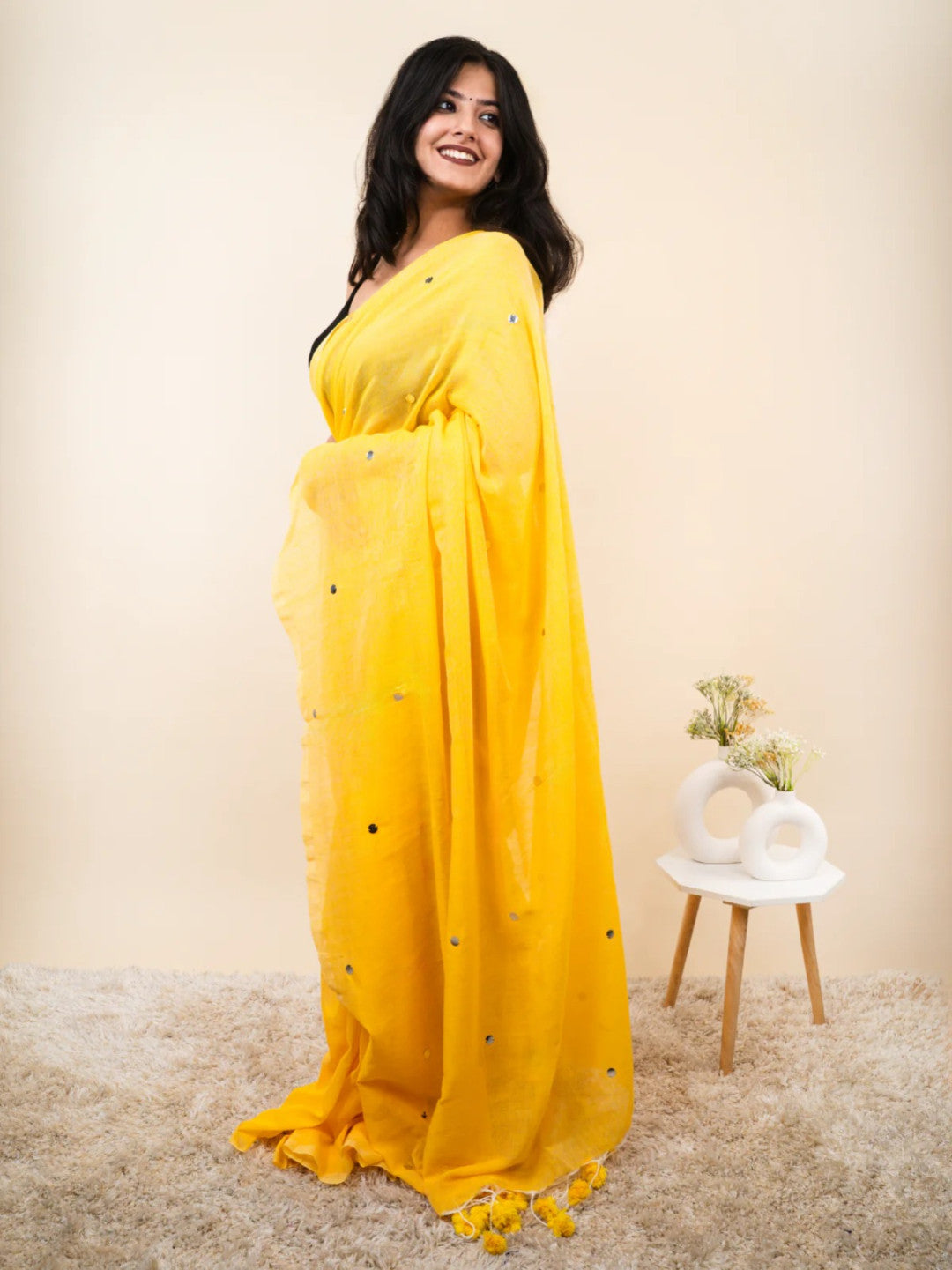Yellow plain khadi cotton saree with ginni and fancy tassel work