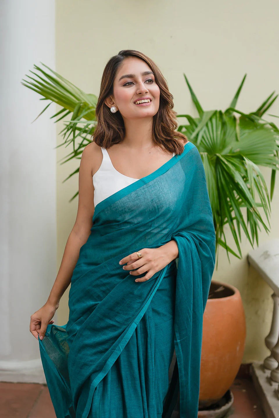 Teal blue plain khadi cotton saree with fancy tassel work