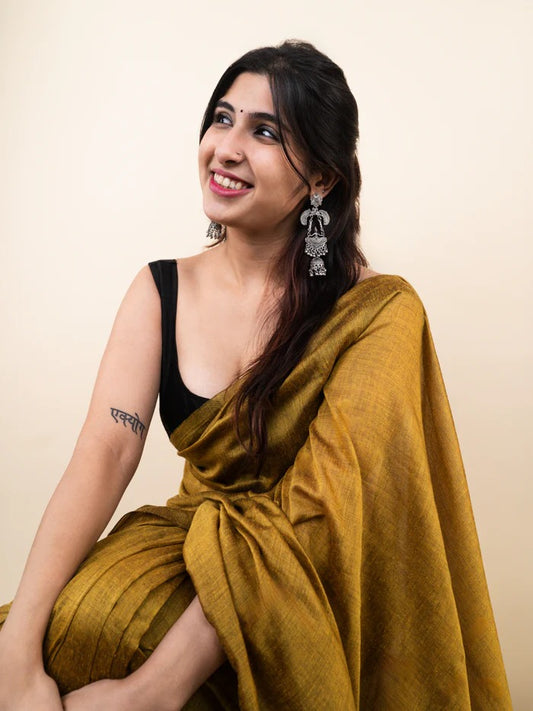 Mustard yellow plain khadi cotton saree with fancy tassel work